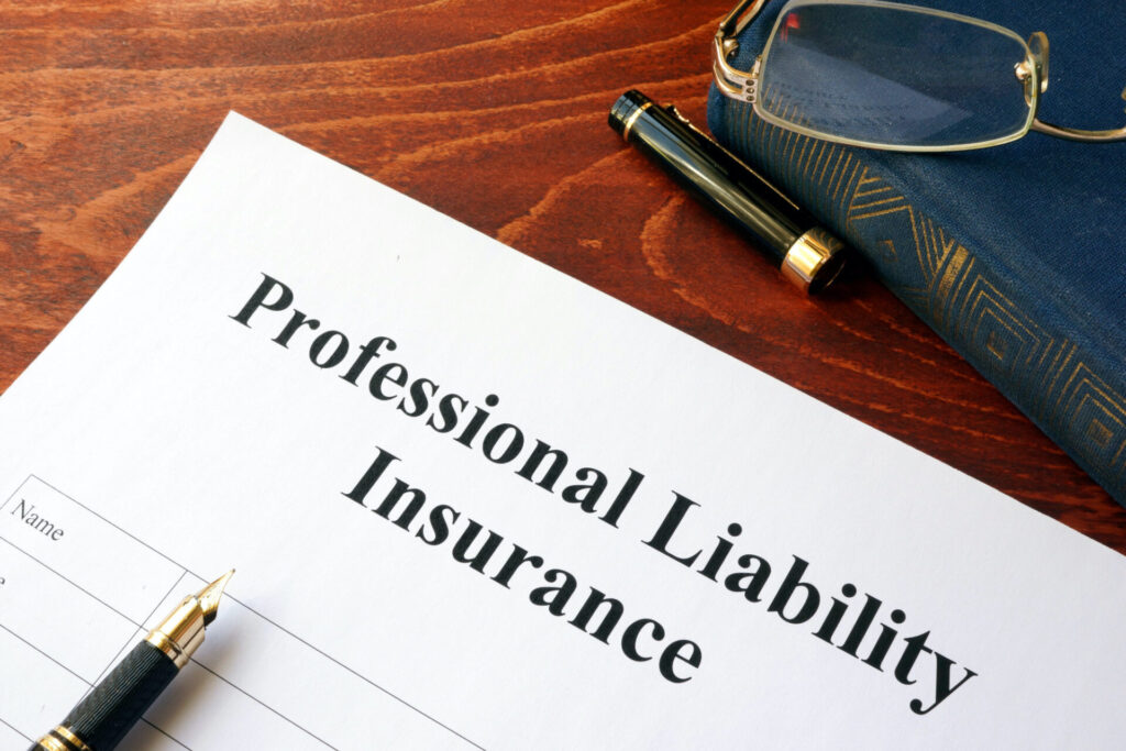 professional liability insurance policy on a table.